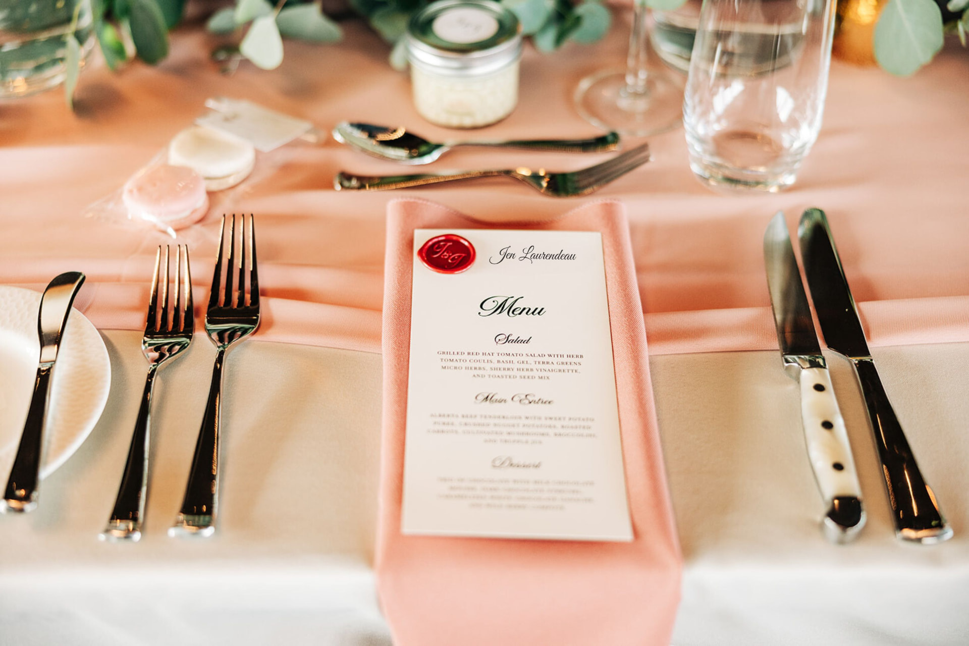 Blush place setting with a wax-sealed menu card at a Calgary wedding