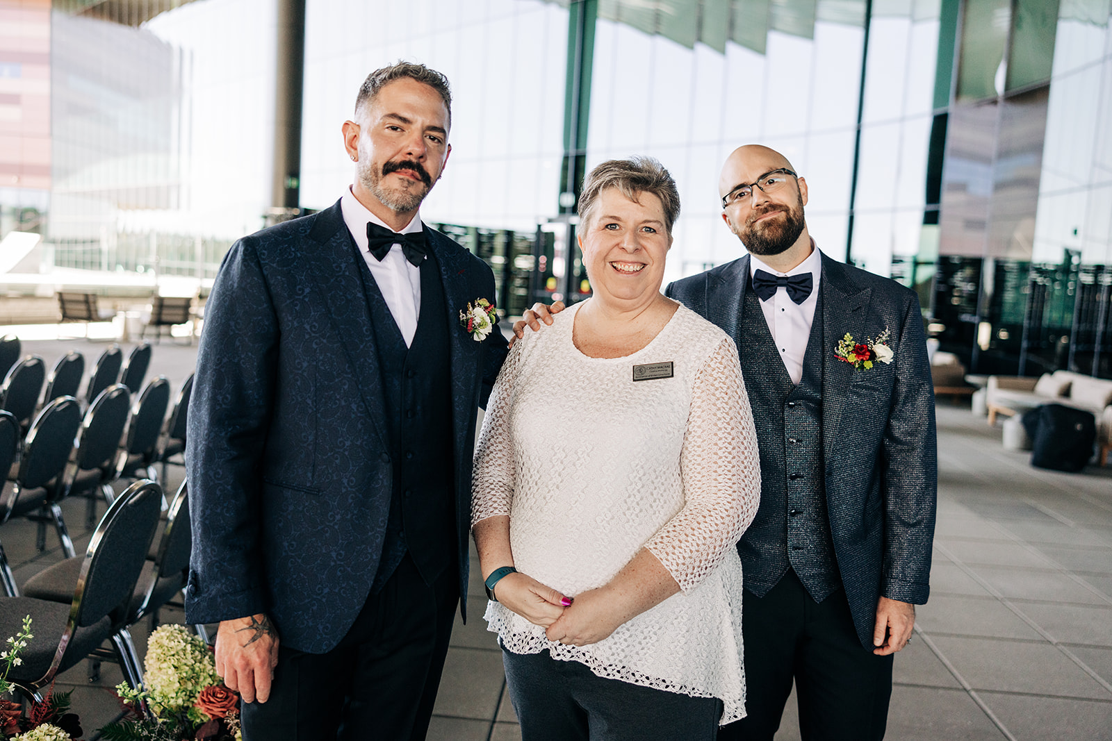 Cathy MacRae with two grooms before their Calgary ceremony